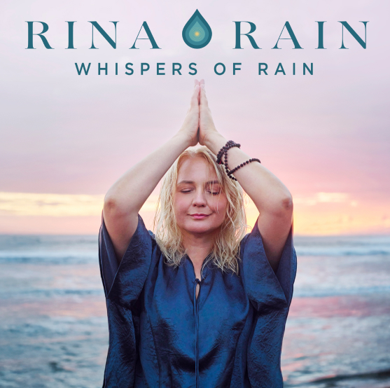 A woman practices meditation by the ocean at sunset, hands pressed together above her head. Text above reads "Rina Rain Whispers of Rain," evoking a tranquil mantra for peace and reflection.